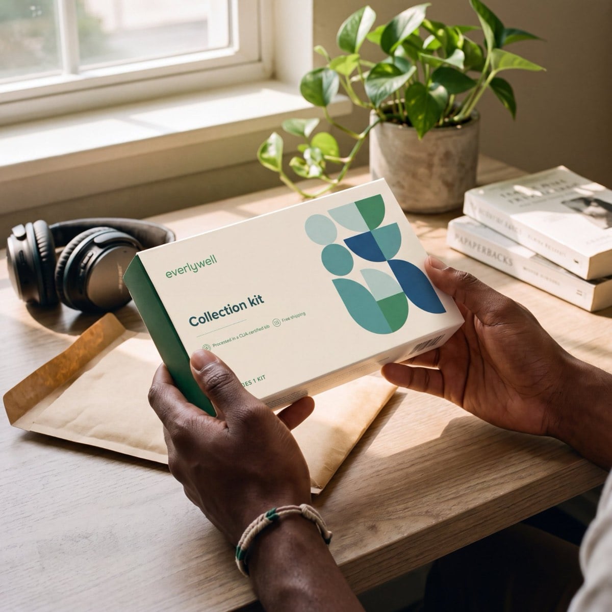 The Chlamydia & Gonorrhea Test kit in hand at home